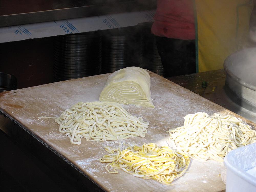 Bowl of Korean hand-cut kalguksu noodle soup, similar to the style served at Jeonju's Veteran Kalguksu since 1977
