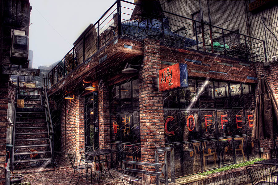 A cozy Korean coffee shop interior, similar in style to Club Espresso in Buam-dong