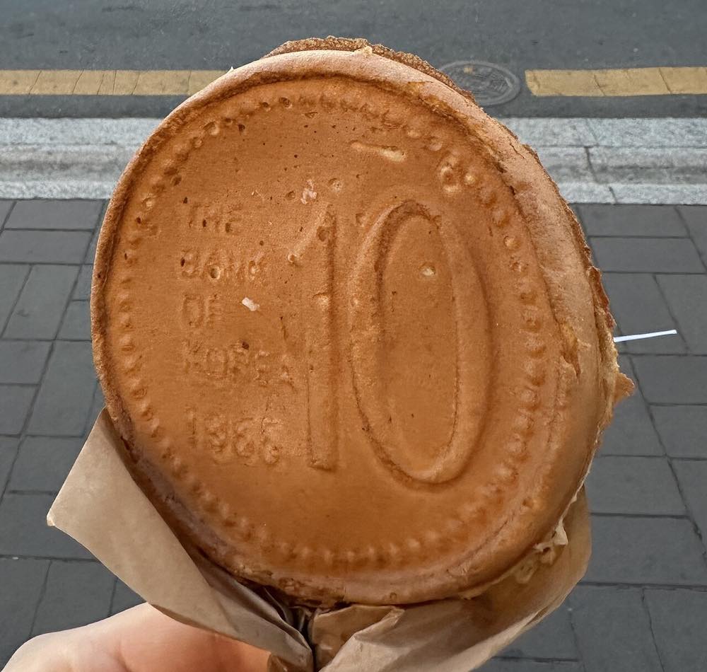 Gyeongju's coin-shaped 10-won bread, a cheese-filled street snack invented on Hwangnidan-gil