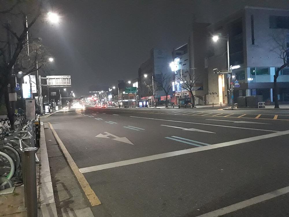 Apgujeong-ro at night, the neighborhood where Cafe Camptong is located