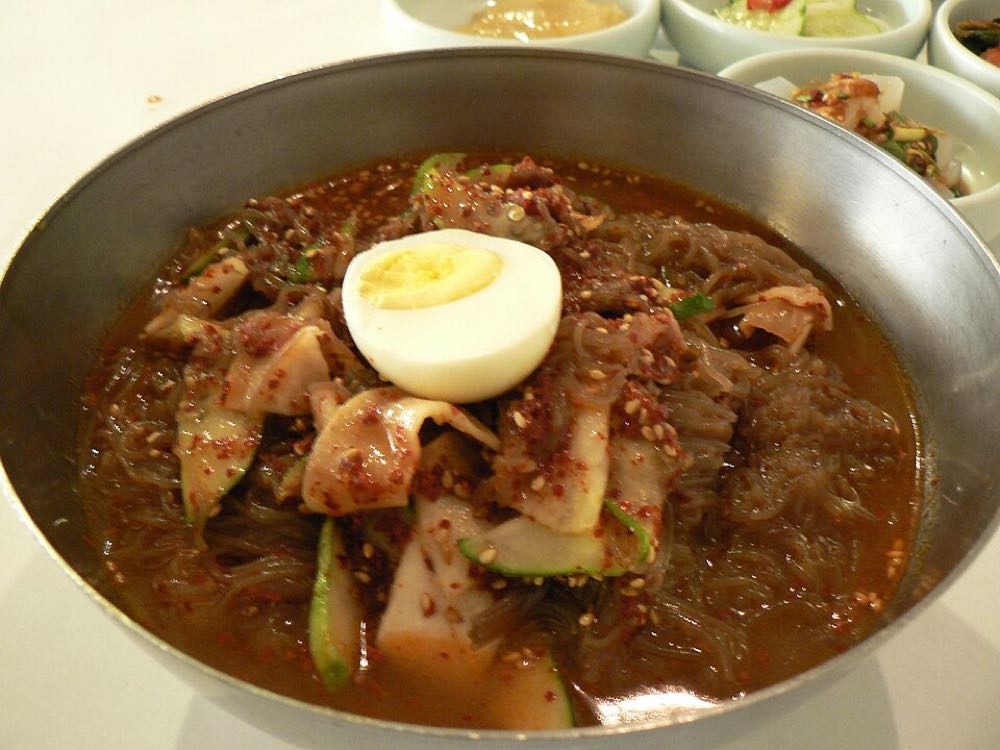 Bibim naengmyeon spicy cold buckwheat noodles served with kalguksu in Namdaemun