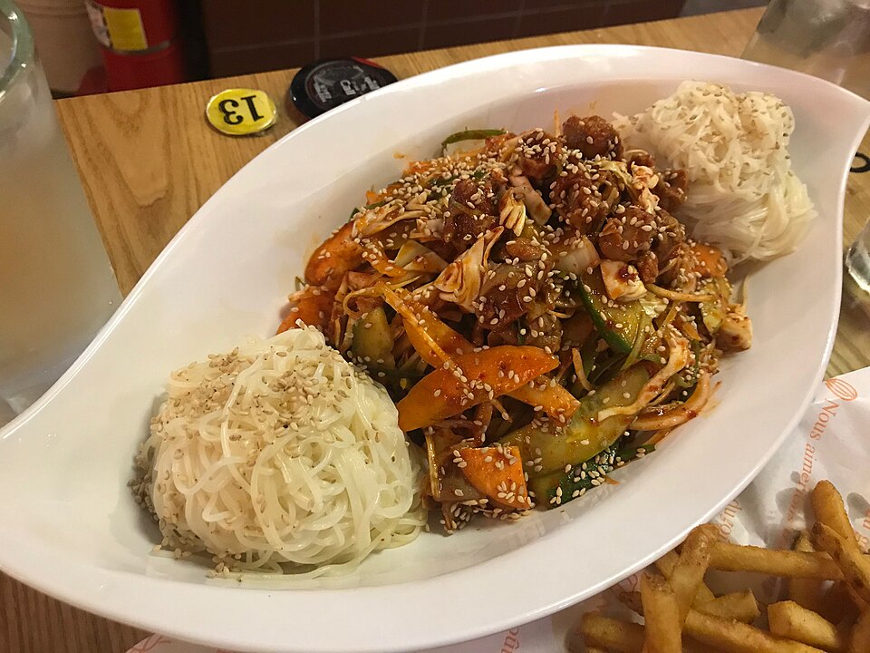Golbaengi muchim, spicy sea snail salad served with noodles in Korea