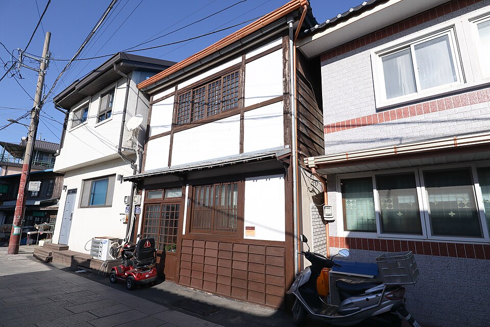 Old Japanese-style wooden buildings along a lane in Guryongpo, Pohang, a filming area for When the Camellia Blooms