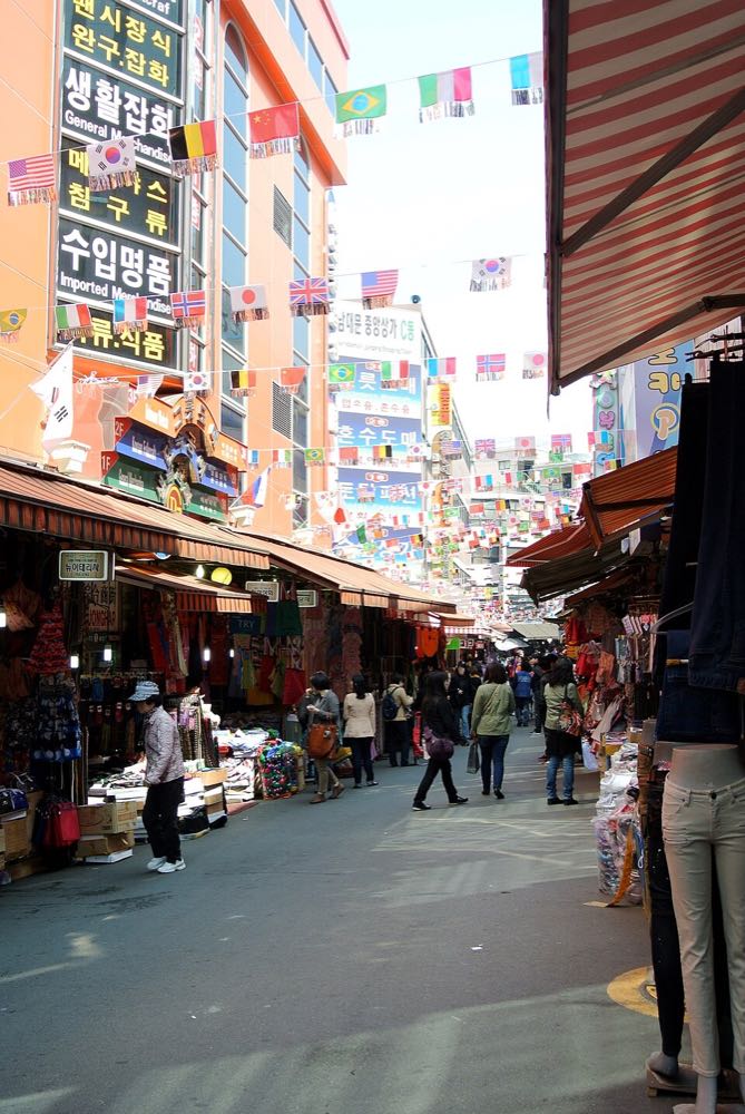 Narrow food alley inside Namdaemun Market in Seoul near Kalguksu Alley