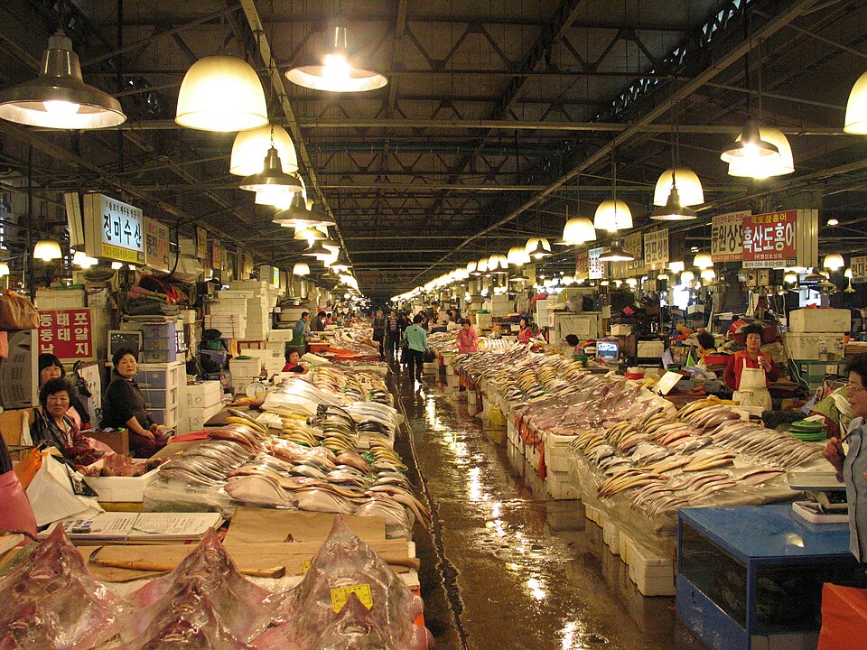 Vendor selling live fish at Noryangjin Fish Market Seoul