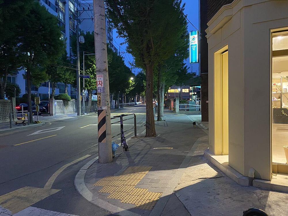Evening street lined with cafes and restaurants in Seongsu-dong, Seoul