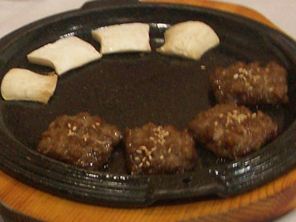 Grilled tteokgalbi Korean beef short rib patties like those sold at Mangwon Market